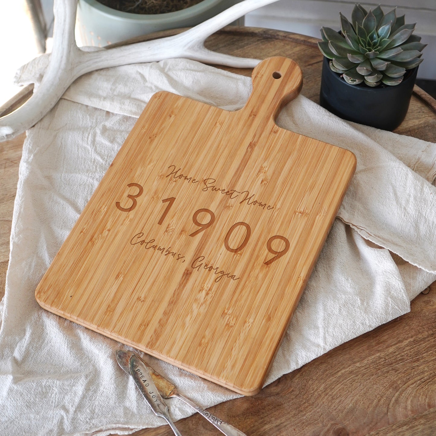 a cutting board with a date engraved on it