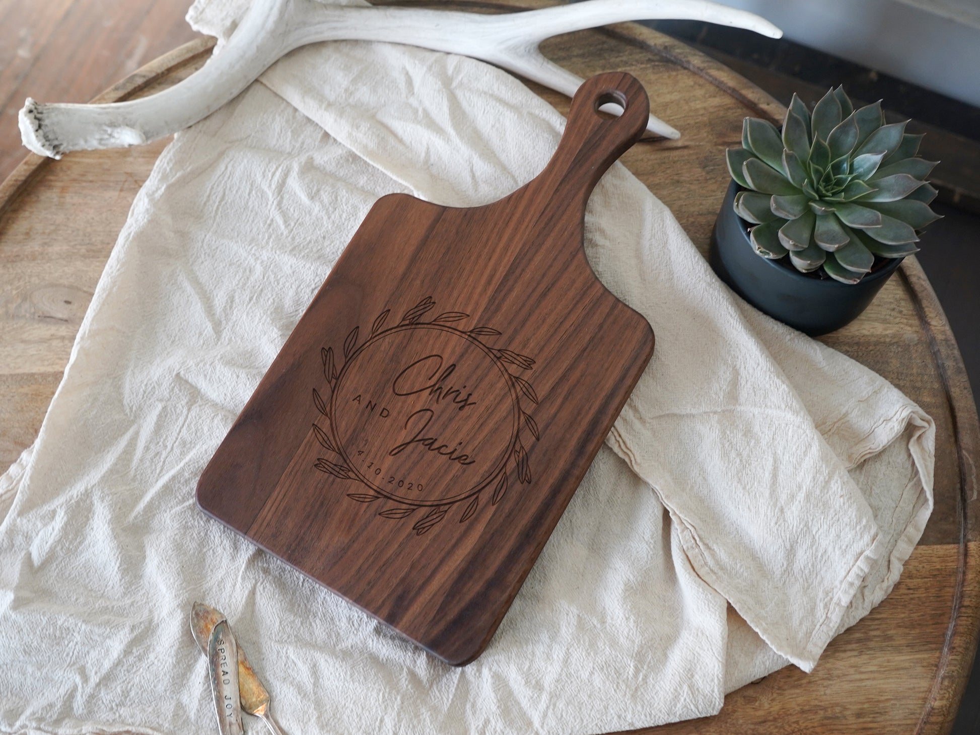 a wooden cutting board sitting on top of a table