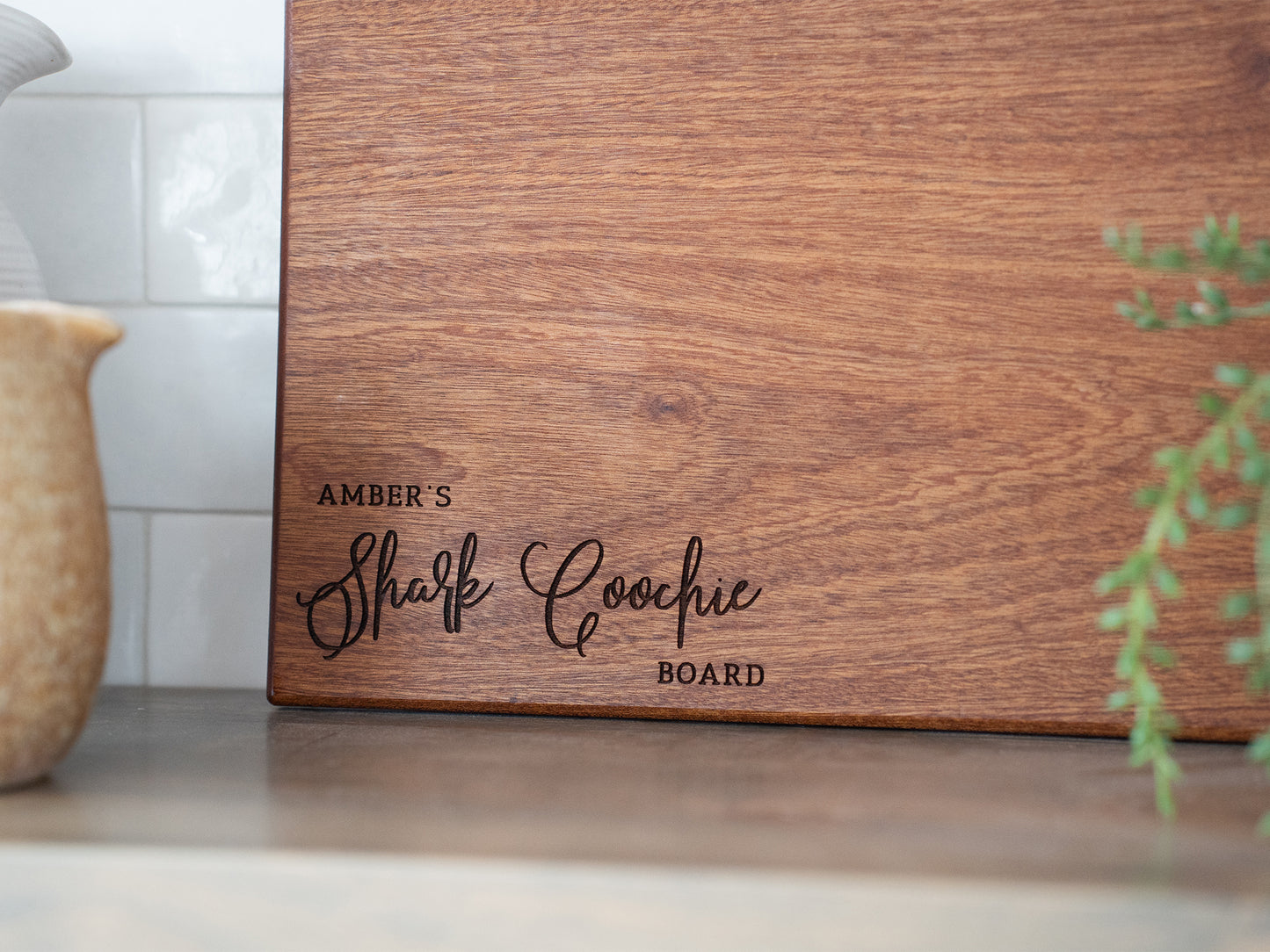 a wooden cutting board sitting on top of a counter