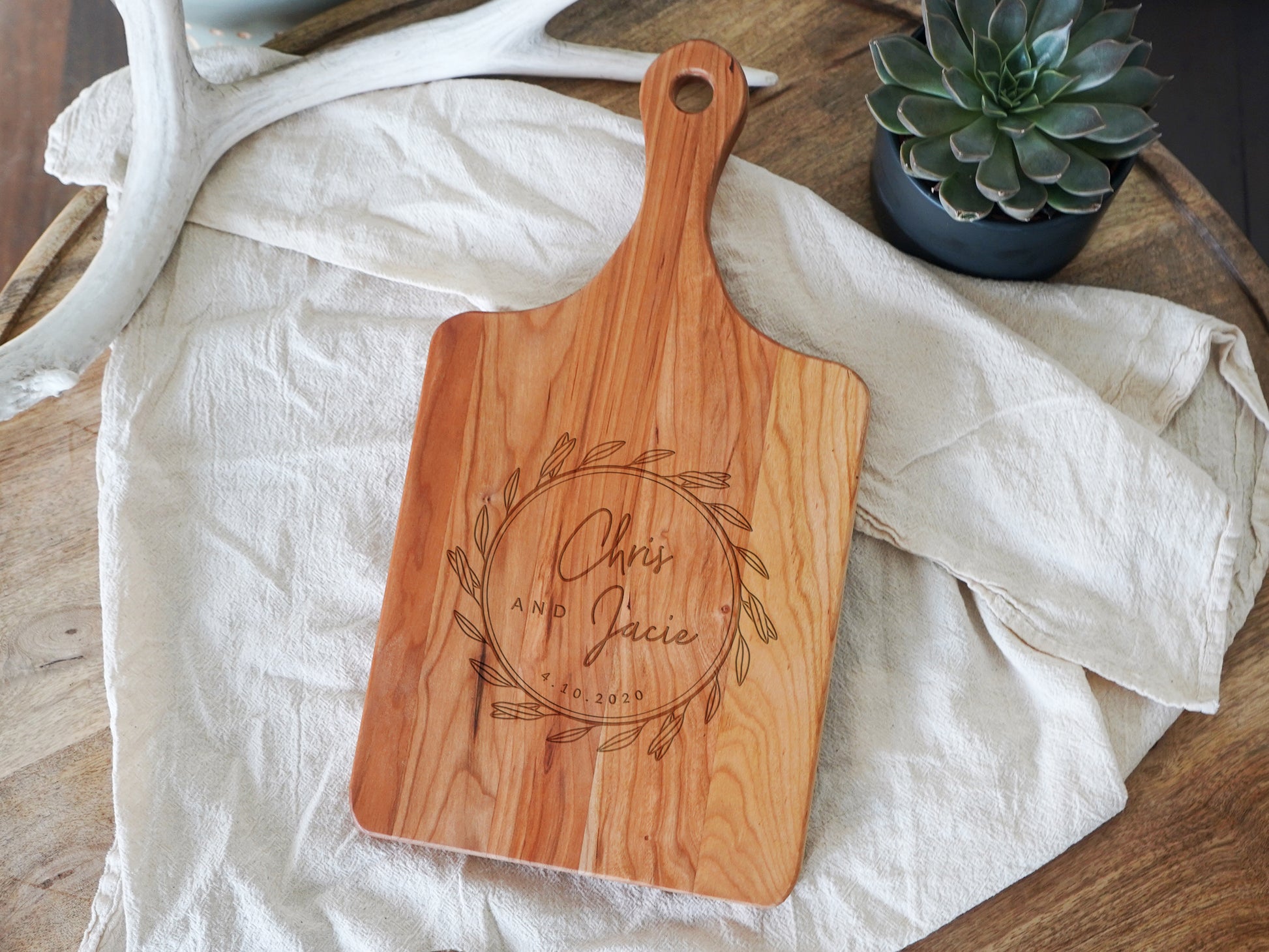 a wooden cutting board sitting on top of a table