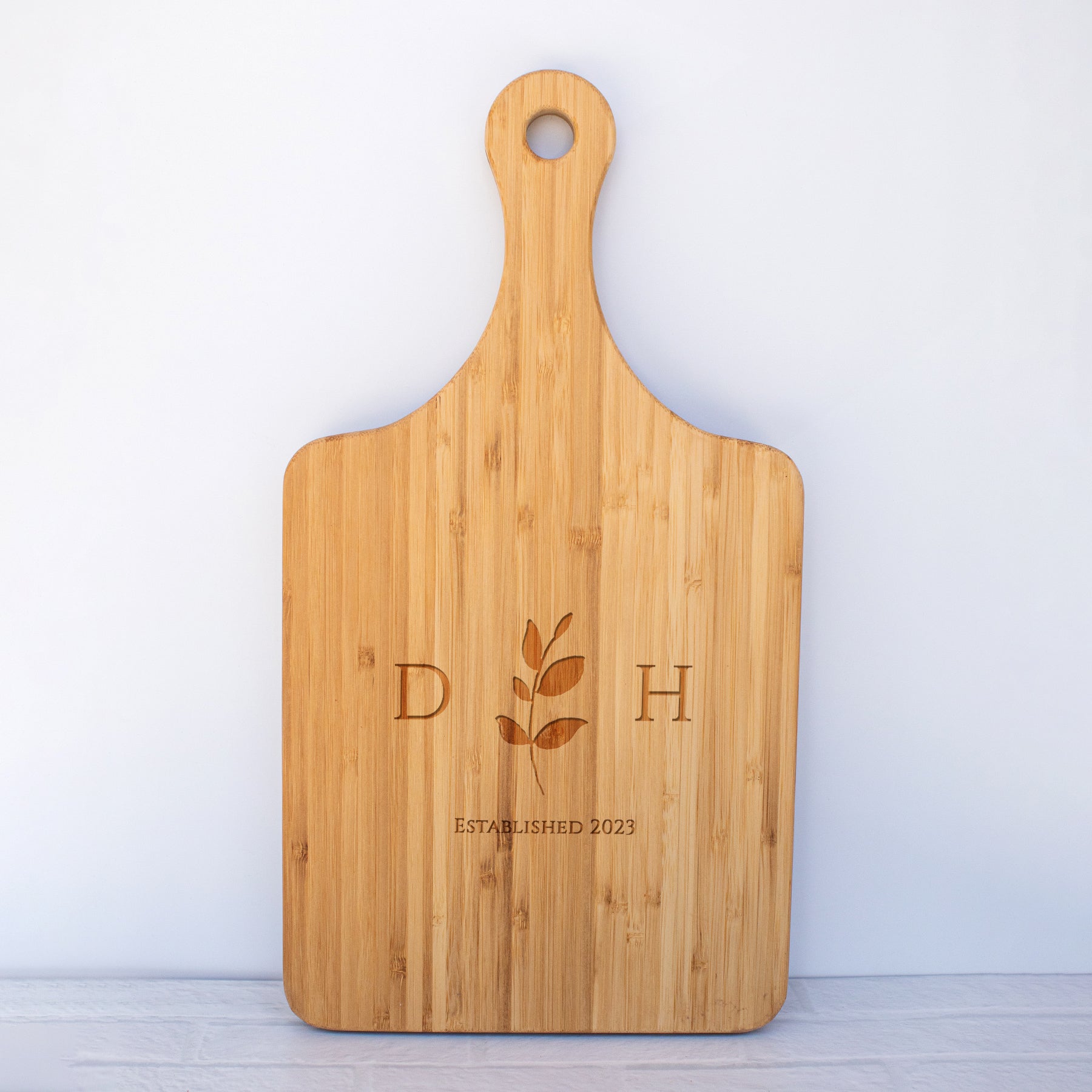 a cutting board with a logo on it