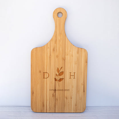 a cutting board with a logo on it