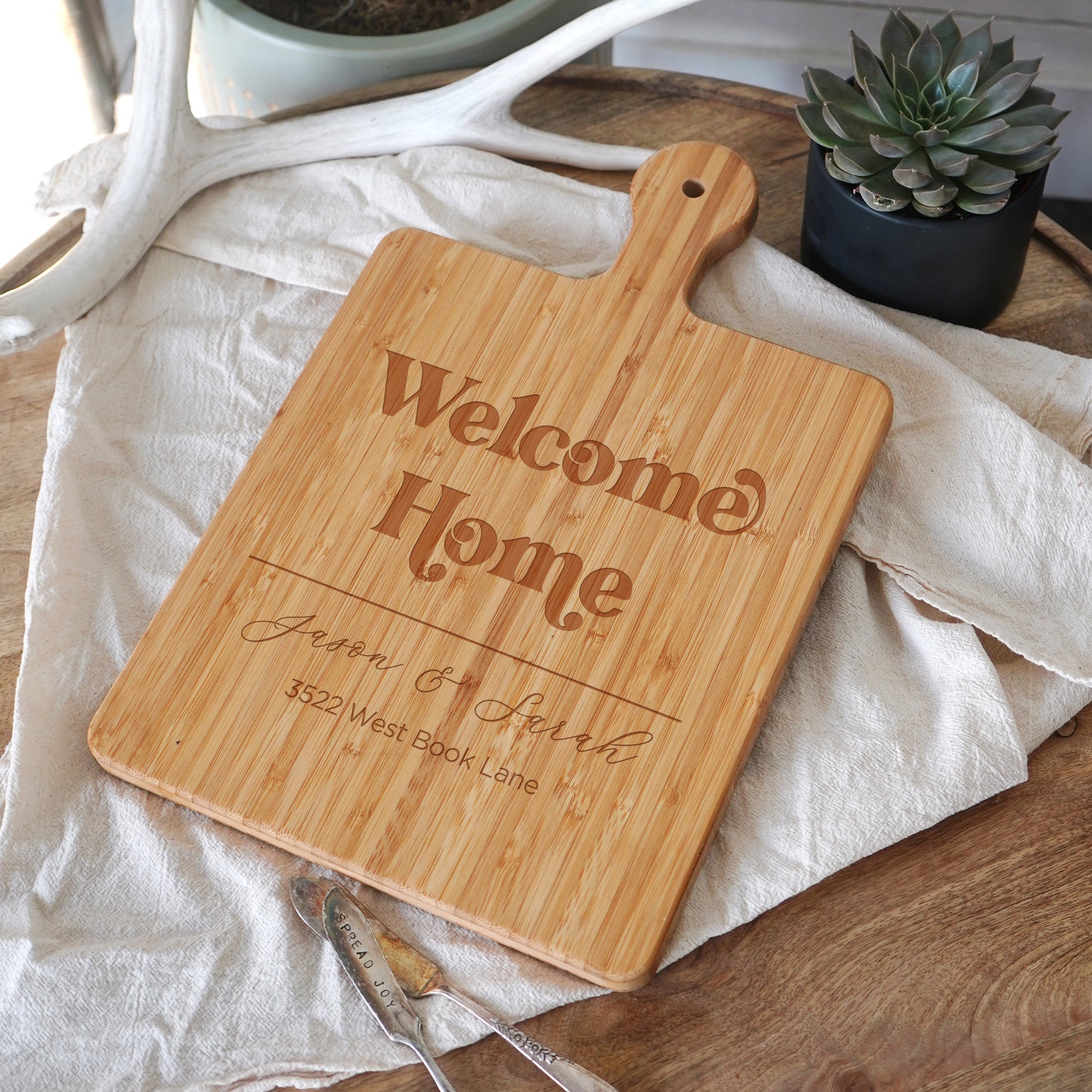 a wooden cutting board sitting on top of a table