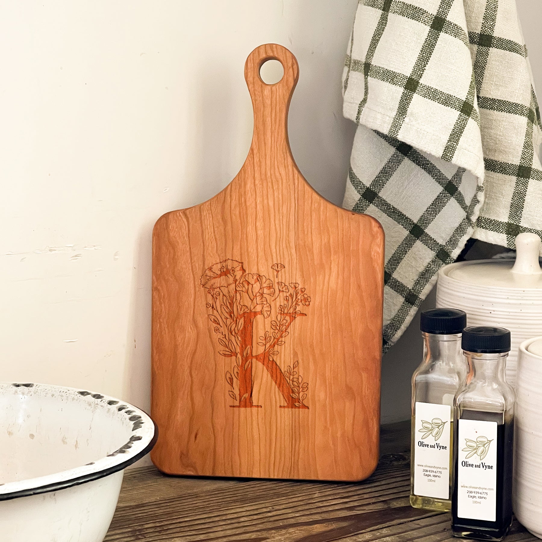 a wooden cutting board sitting on top of a table