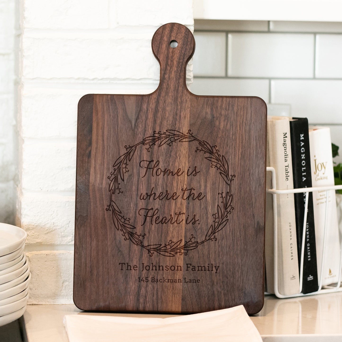 a wooden cutting board sitting on top of a counter
