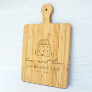 a cutting board with a picture of a building on it