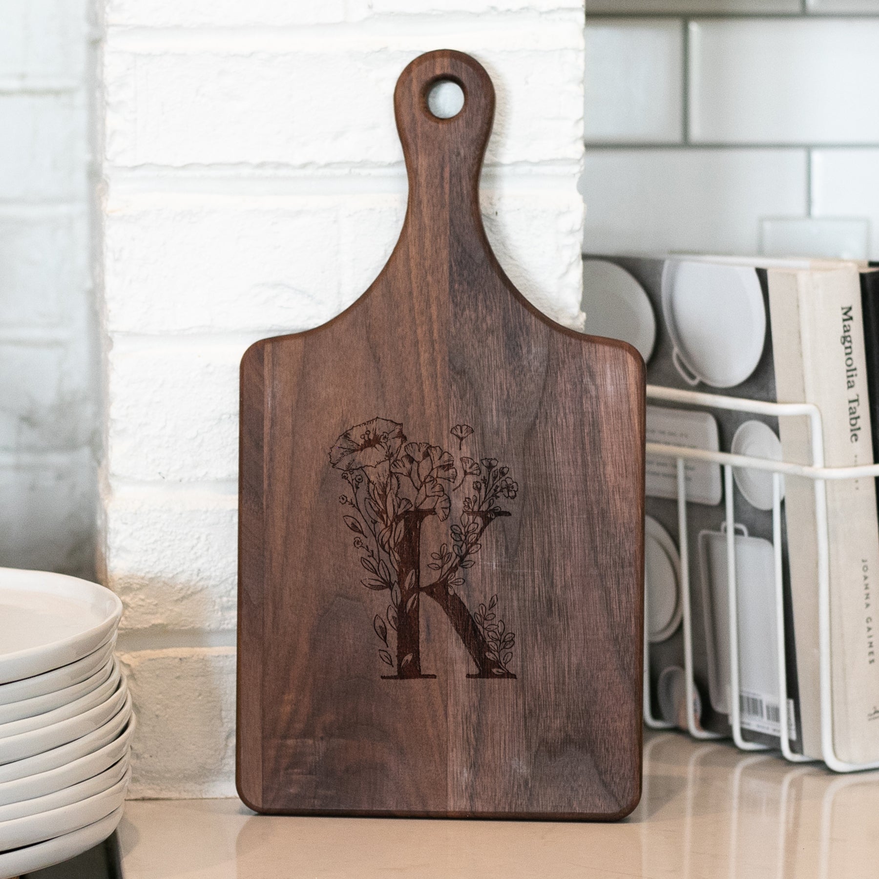 a wooden cutting board sitting on top of a counter
