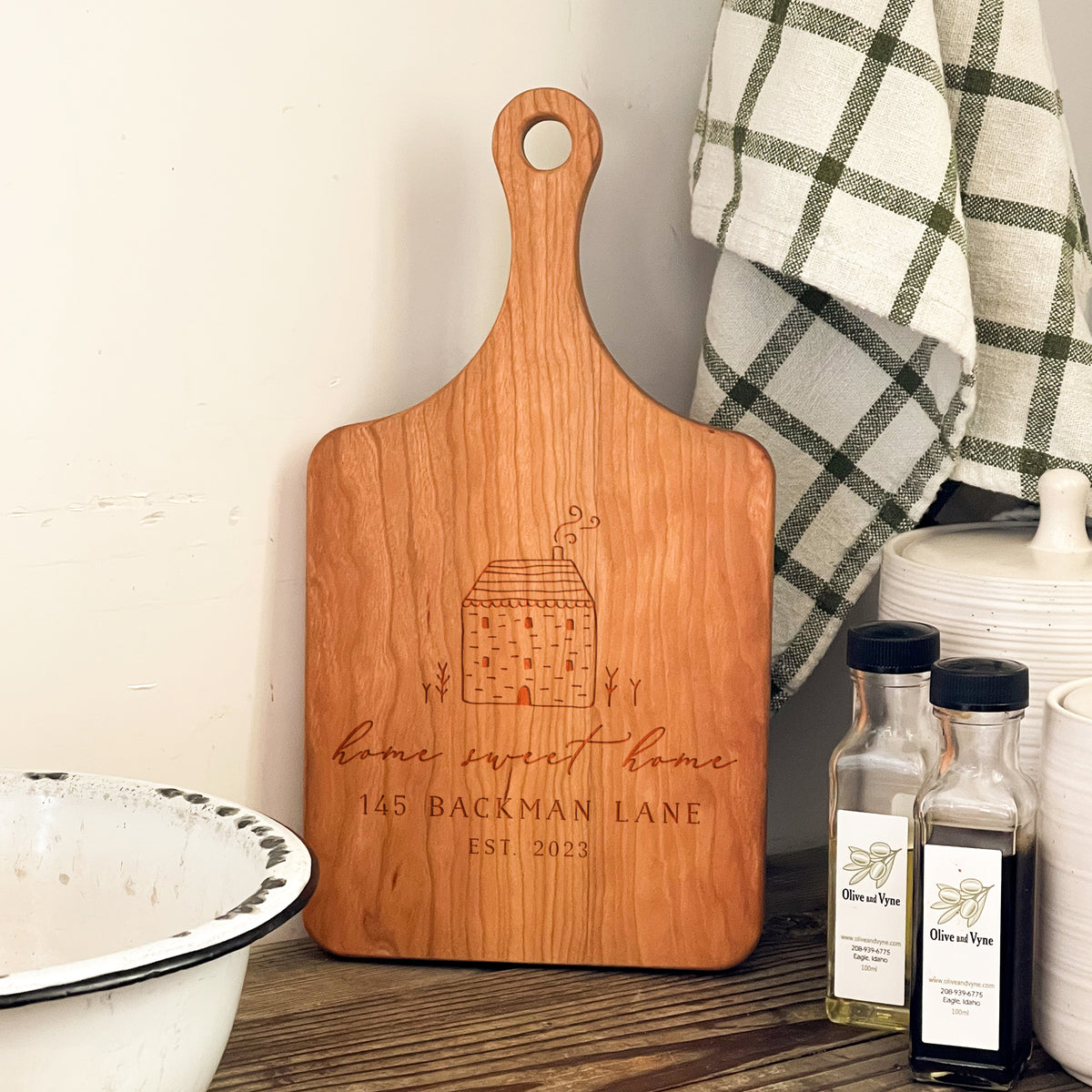 a wooden cutting board sitting on top of a table