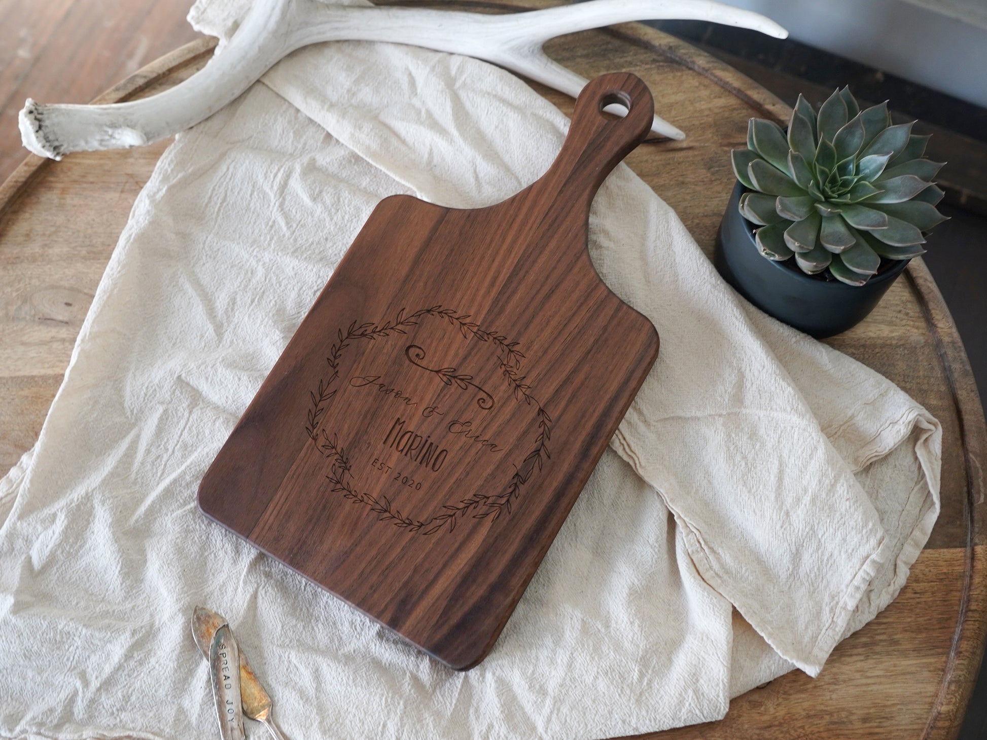 a wooden cutting board sitting on top of a table