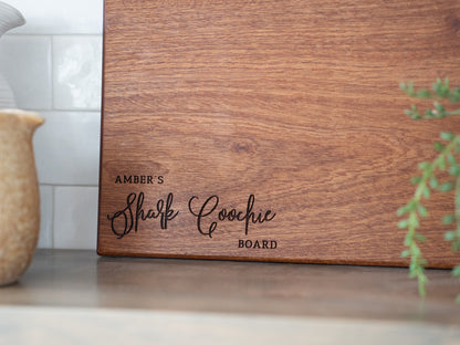 a wooden cutting board sitting on top of a counter