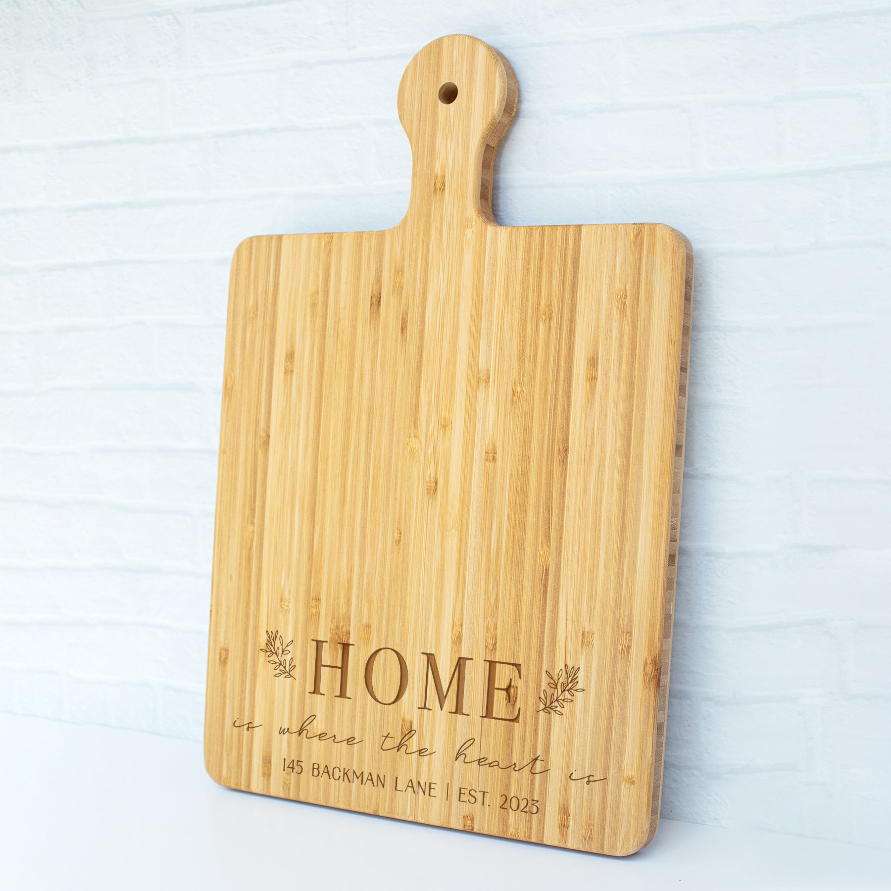 a cutting board with a name on it