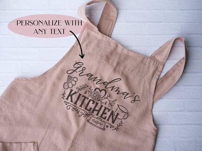 a pink apron with the words personalized on it