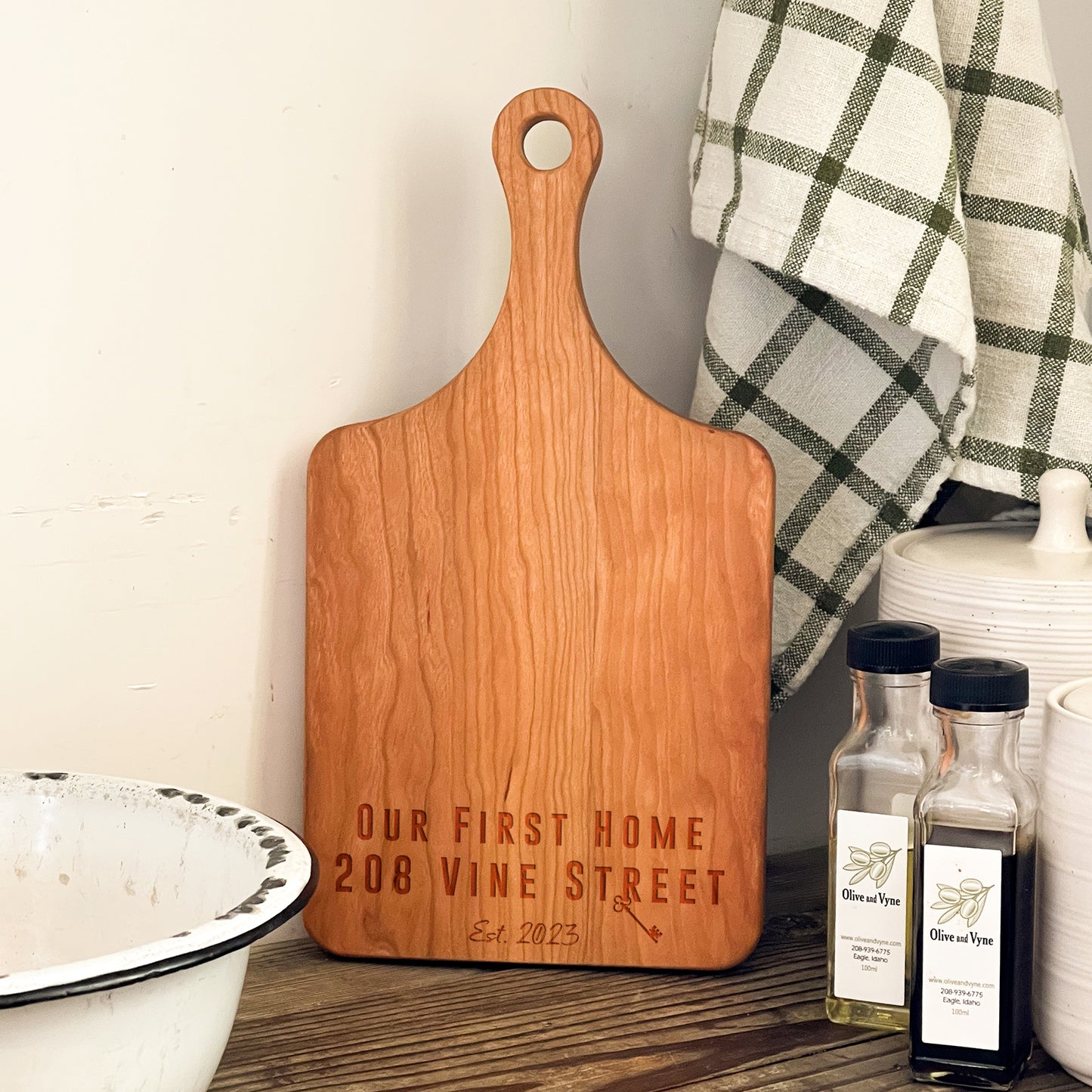 a wooden cutting board sitting on top of a table