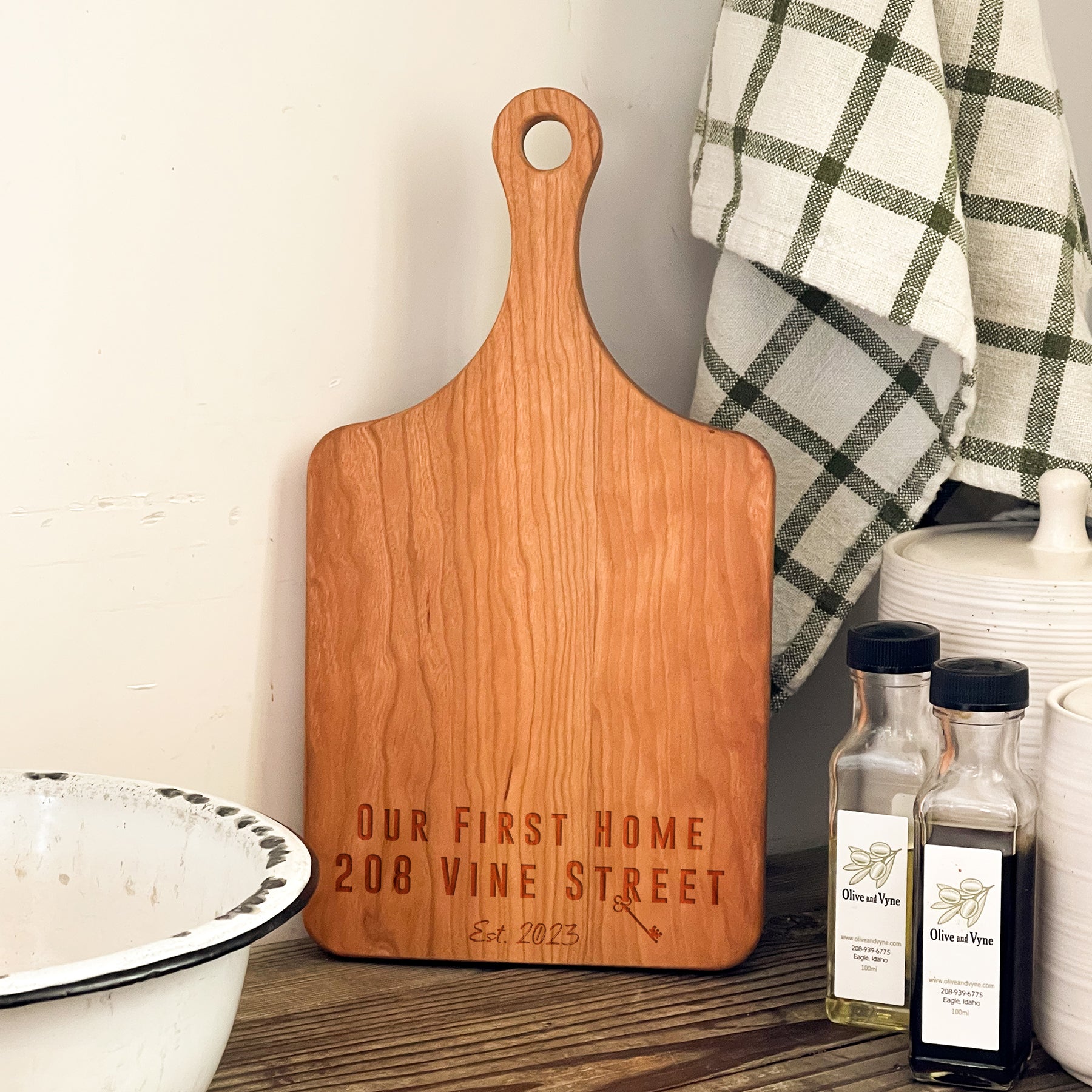 a wooden cutting board sitting on top of a table