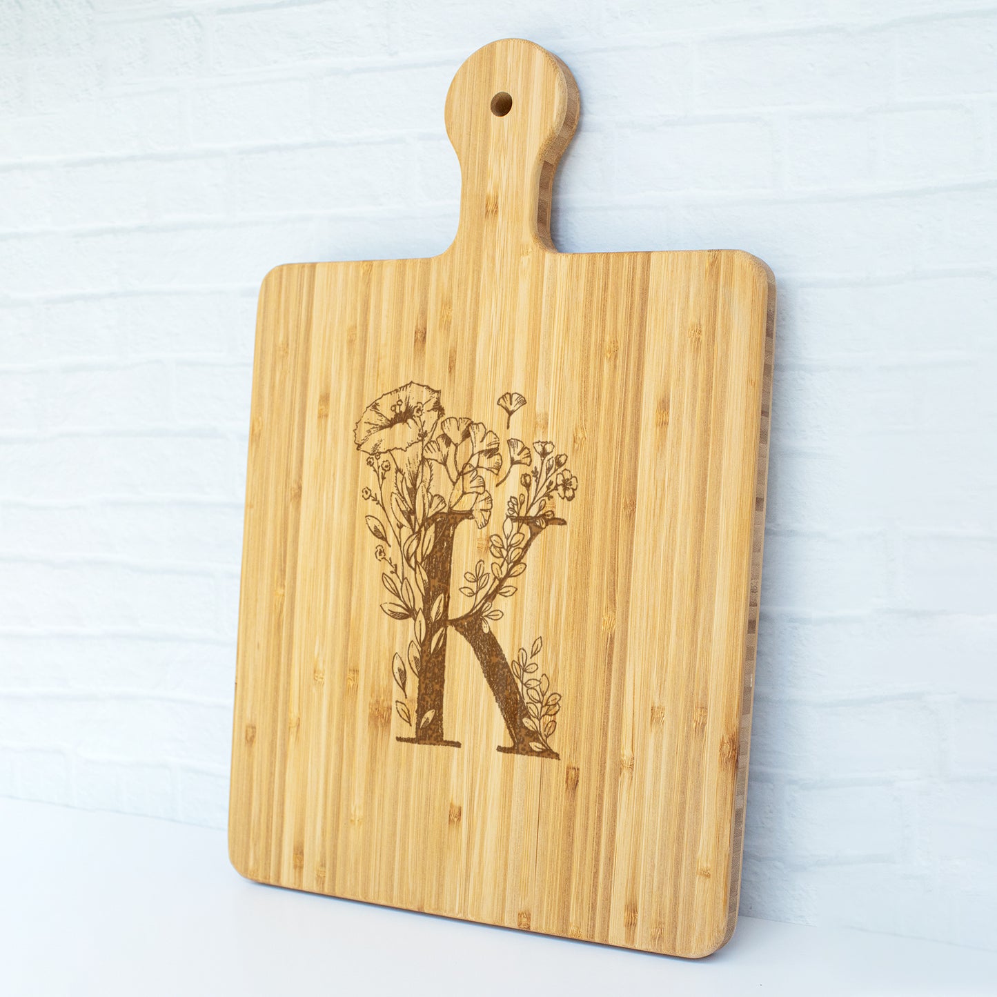 a cutting board with a picture of a tree on it