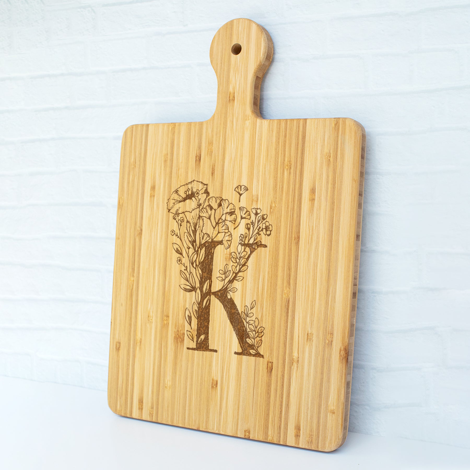 a cutting board with a picture of a tree on it