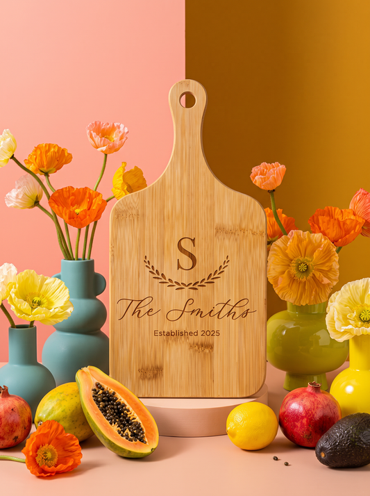 Large Initial Family Name Cutting Board in a colorful floral setting