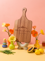 Floral Wreath Wedding Cutting Board in a colorful floral setting