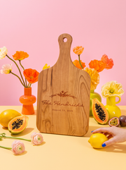 Floral Wreath Wedding Cutting Board in a colorful floral setting