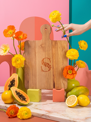 Monogram 3 Cutting Board in a colorful floral setting