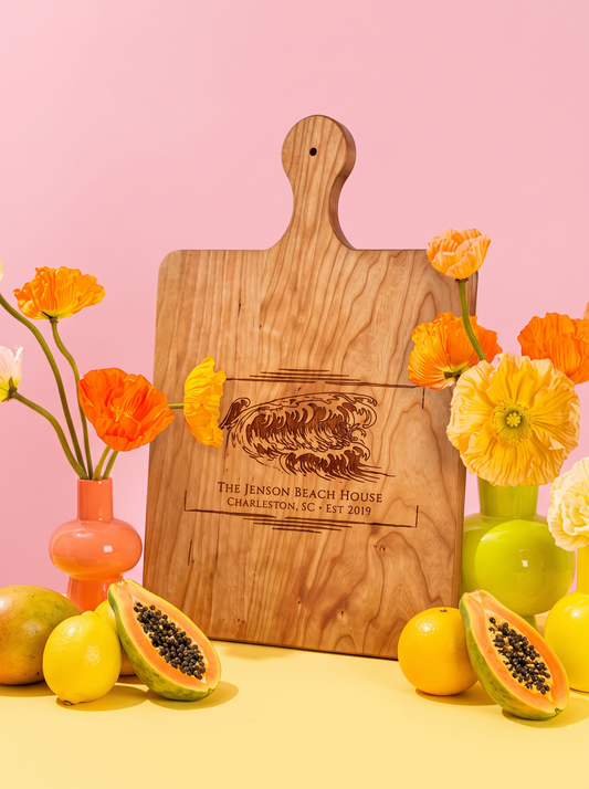 Coastal Wave Name Cutting Board in a colorful floral setting