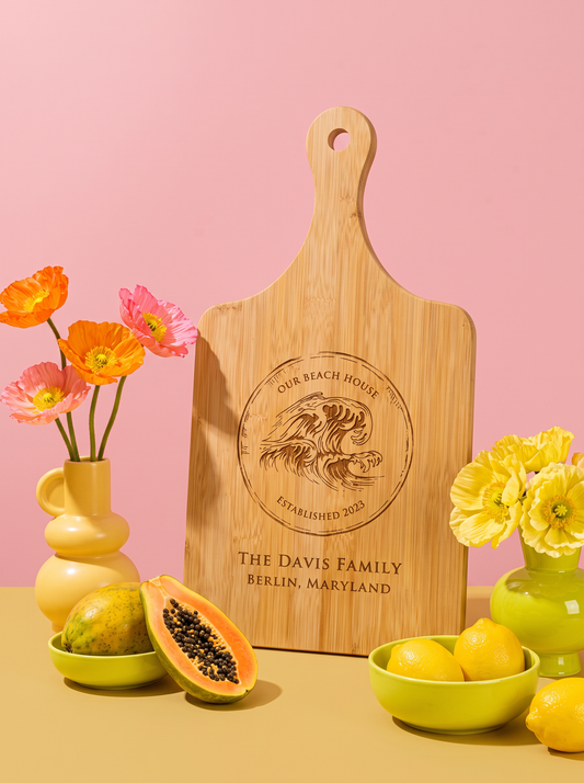 Our Beach House Cutting Board in a colorful floral setting