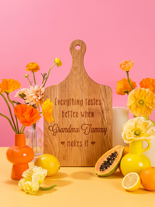 Everything Tastes Better at Grandma’s Cutting Board in a colorful floral setting