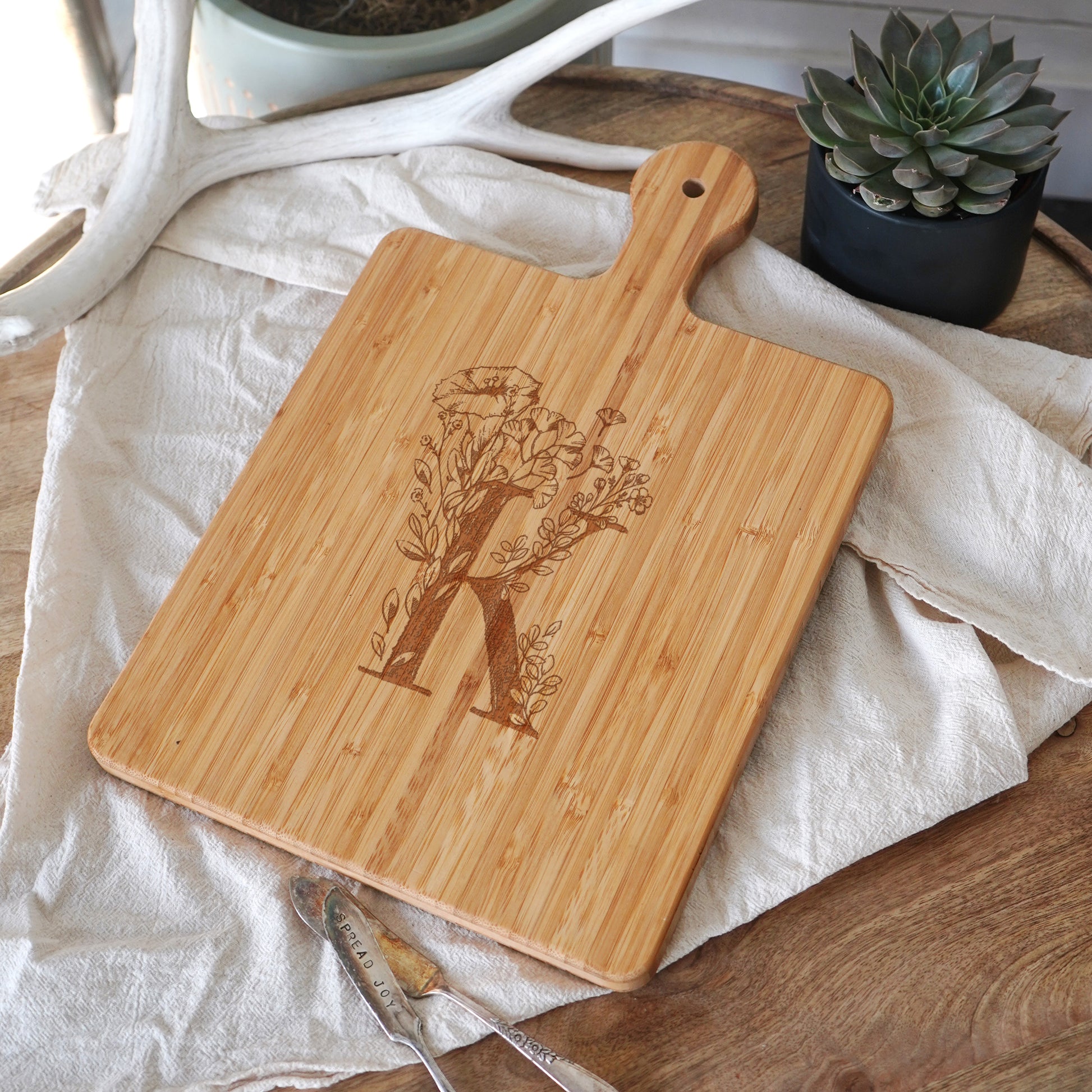 a cutting board with a picture of a tree on it