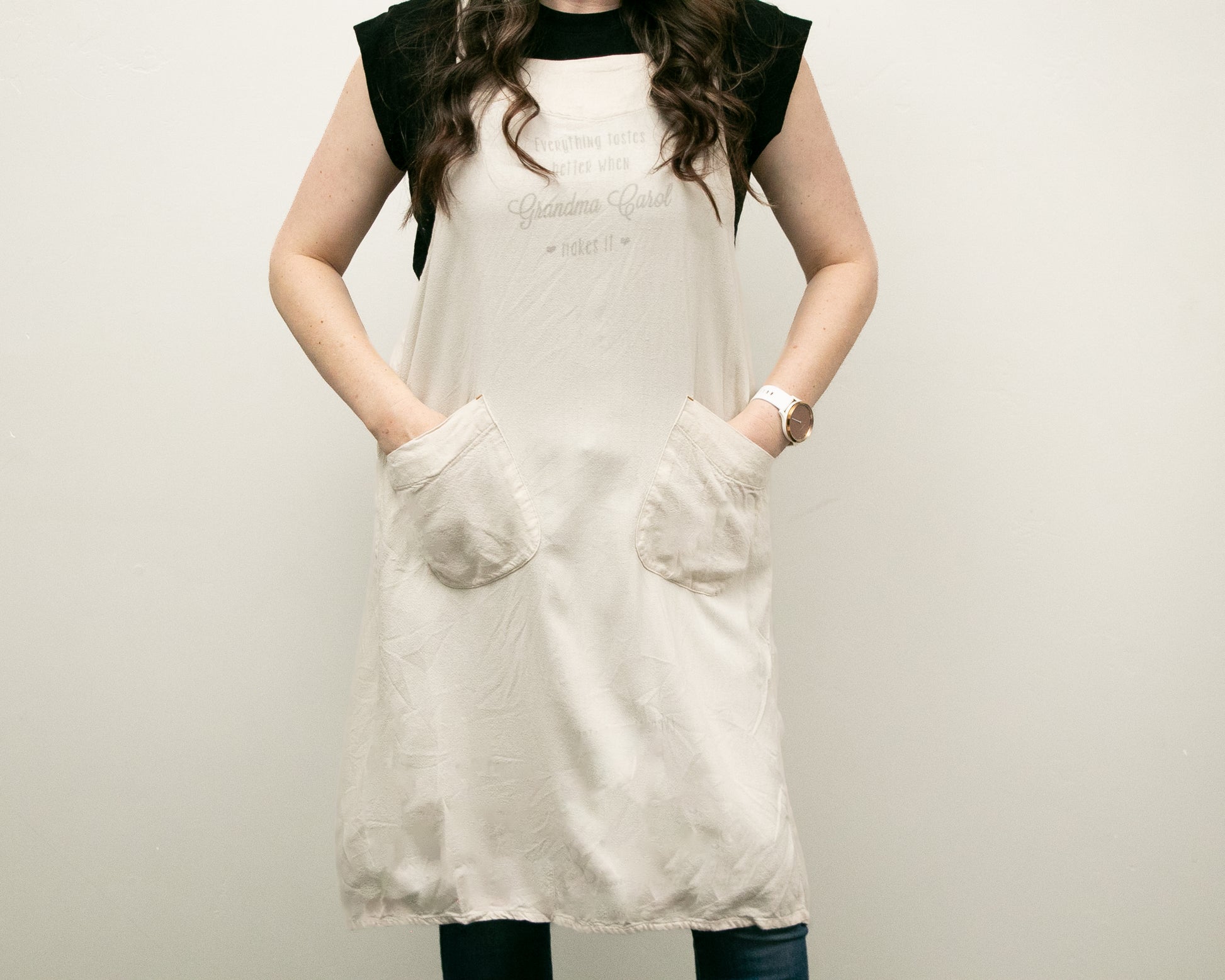 a woman wearing a white dress and black hat