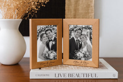 Personalized double wood frame displaying two black-and-white wedding portraits, with each couple’s names and wedding date engraved below.