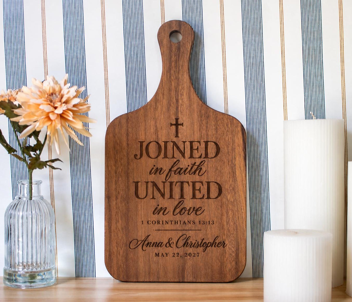 Joined in Faith engraving mockup on a small walnut handled board, with cross, Anna & Christopher and May 22, 2027.