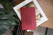Places journal mockup with a deep rose-colored cover on an interiors catalog beside green leaves; coastal artwork with Alex & Morgan and September 19, 2026.