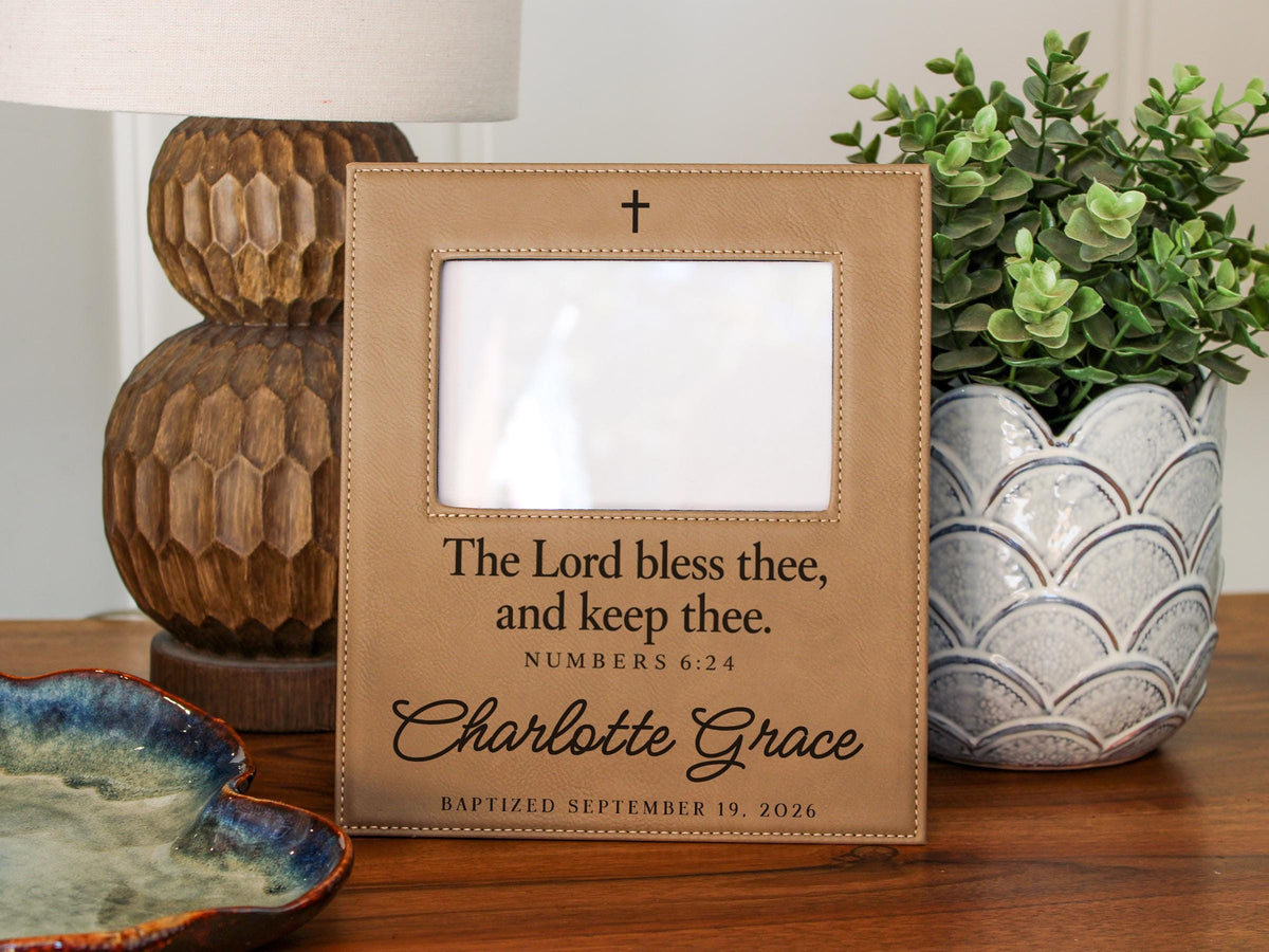 Edited mockup for Gift Options: None. The charlotte grace frame has an empty photo opening, cross, Numbers 6:24 blessing, sample name and baptism date; no photograph is inserted.
