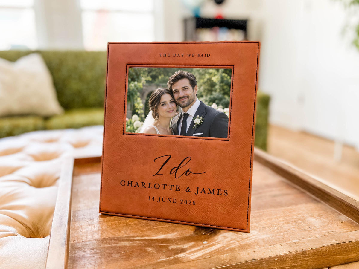 I Do wedding frame mockup on a wooden tray, with an illustrative couple photo and the sample names Charlotte & James and date 14 June 2026.