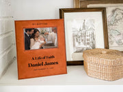 Edited mockup of the life of faith baptism frame on a shelf beside a basket, personalized for Daniel James with September 19, 2026 and an illustrative baby baptism photo.