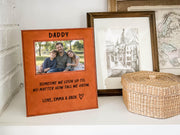 Edited mockup of the tall we grow Daddy frame beside a woven basket and framed art, with a sample dad-and-children photo, engraved saying, Love, Emma & Jack signature and outline heart.