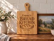Generated engraving mockup of Emma’s Bread Kitchen with loaf, wheat and EST. 2020 on a bamboo paddle board.