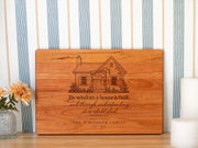 Edited mockup of a rectangular board engraved with a garden cottage, Proverbs 24:3, family name and date.