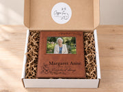 Edited a life so loved memorial frame mockup in an open gift box with crinkle paper, personalized Margaret Anne, 1939-2025, with an illustrative portrait.