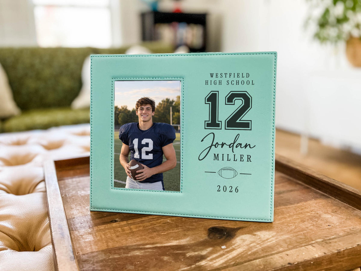 Teal Varsity Football frame mockup on a wooden tray, with a sample football player portrait on the left and school, number, name, football, and year on the right.