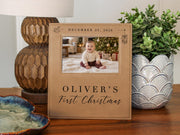 Edited mockup of Xmas Rocking Horse frame beside a lamp and plant, with a baby Christmas photo, December 25, 2026 and Oliver’s First Christmas engraving.