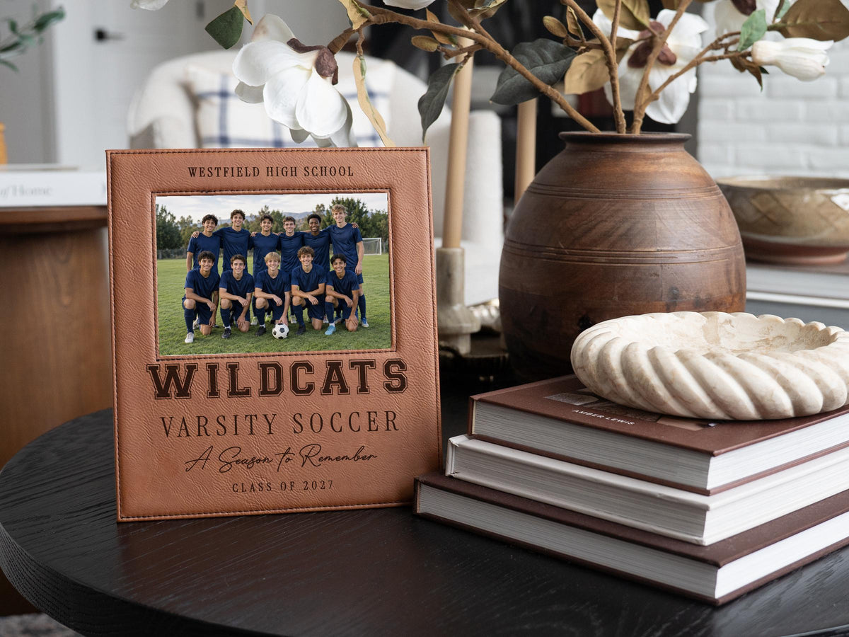 Edited Varsity Season frame mockup with an illustrative soccer team photo and sample Westfield High School, Wildcats, Varsity Soccer, A Season to Remember and Class of 2027 engraving.