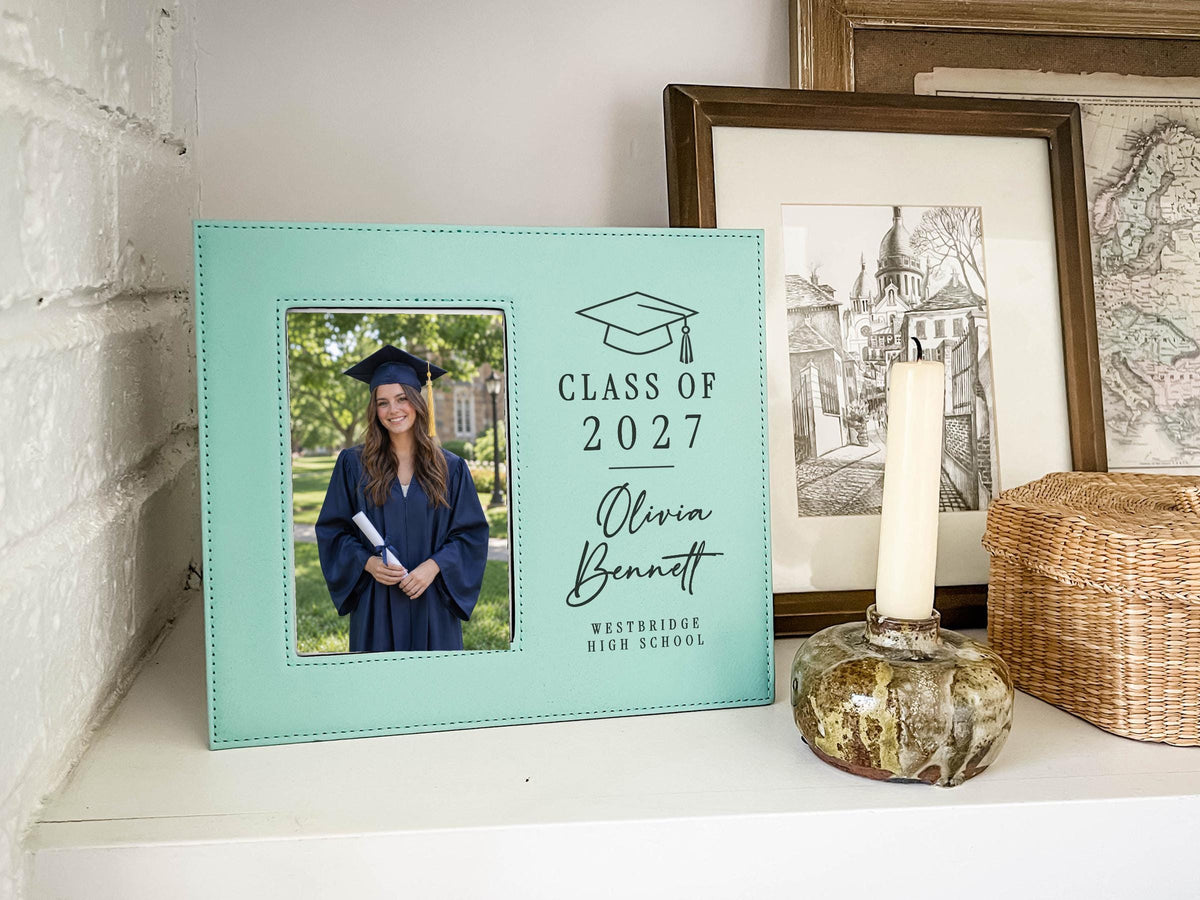 Grad Cap engraved frame reading Class of 2027, Olivia Bennett, Westbridge High School, with an illustrative graduation portrait. Edited mockup with sample personalization.