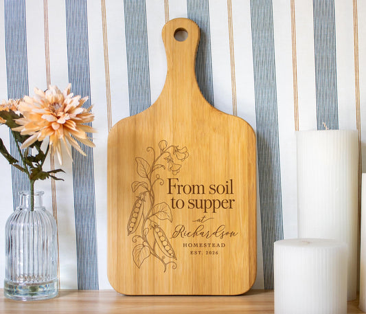 Soil to Supper cutting board mockup with a climbing pea vine and sample Richardson Homestead personalization.