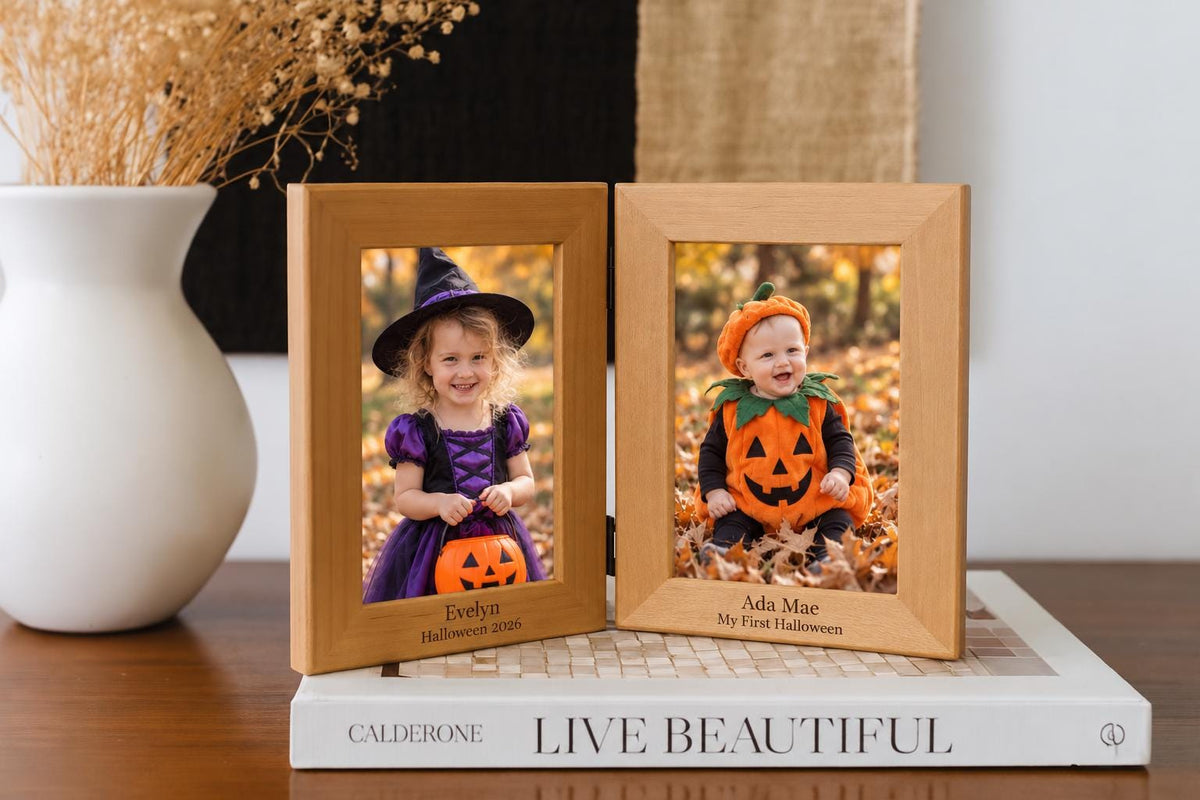 Personalized double wood photo frame with color witch and pumpkin costume portraits and Halloween engraving.