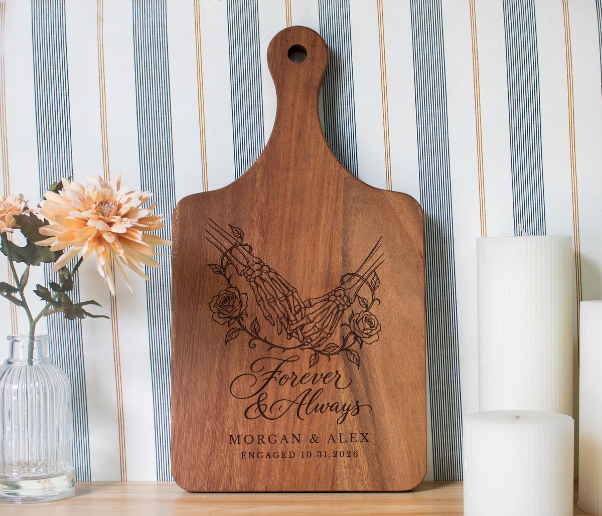 Forever Hand in Hand cutting board design with skeleton hands, roses, and sample names Morgan & Alex
