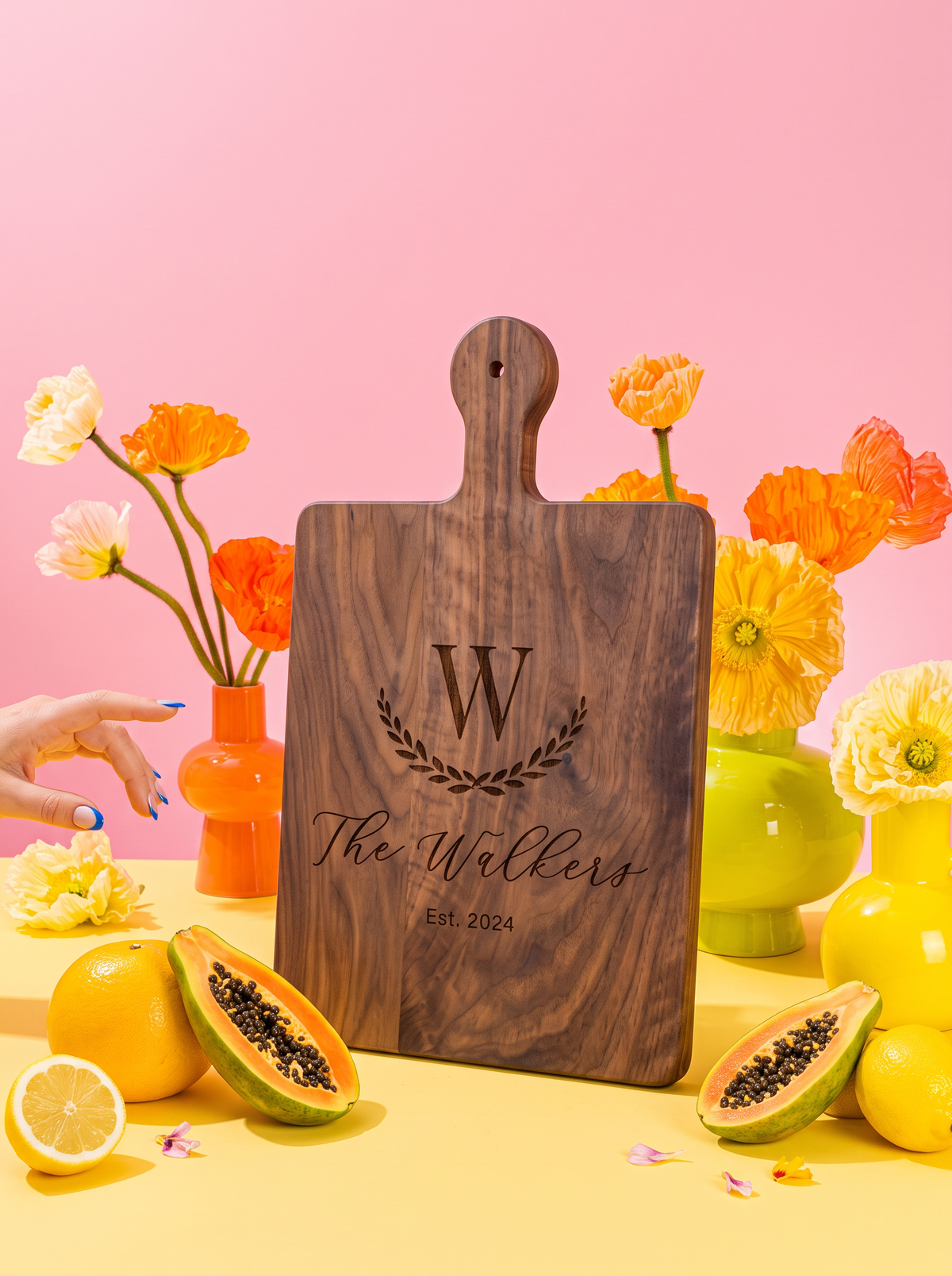Large Initial Family Name Cutting Board in a colorful floral setting