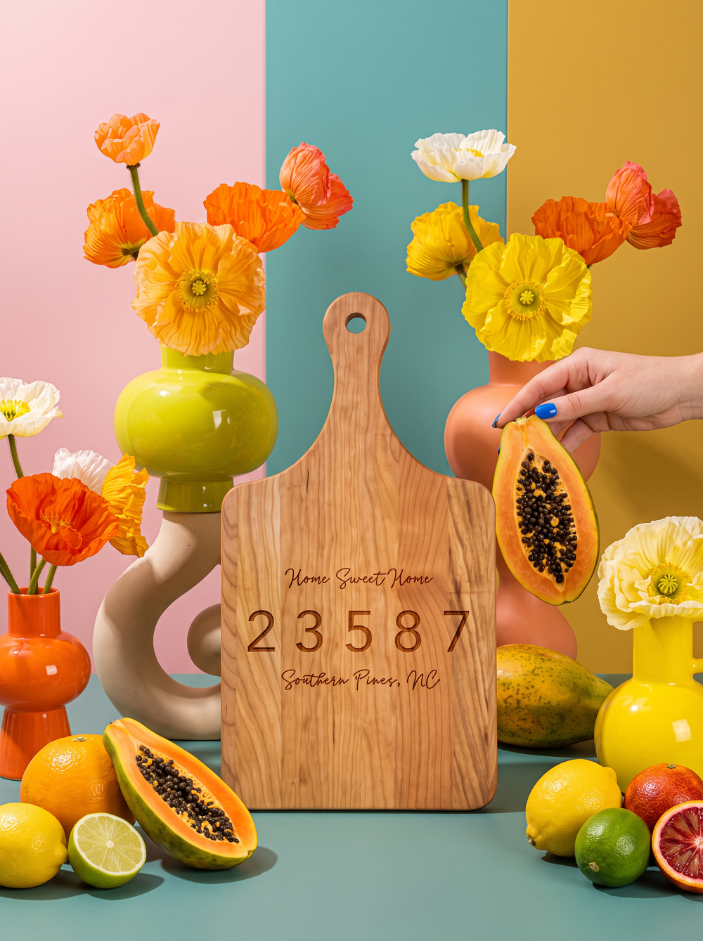 Home Sweet Home Zip Code Cutting Board in a colorful floral setting
