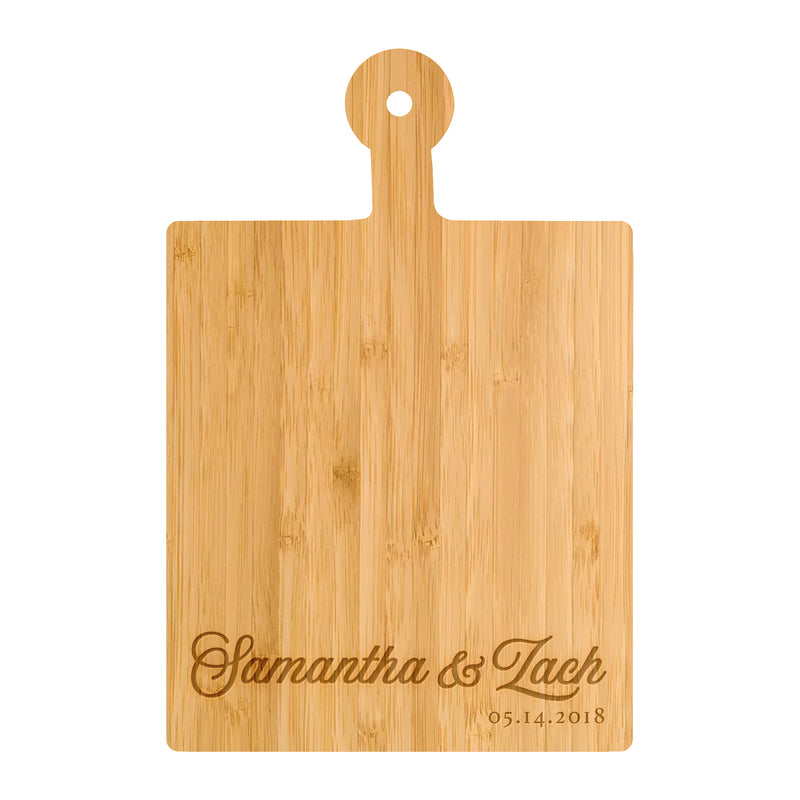 a cutting board with the name of a couple on it