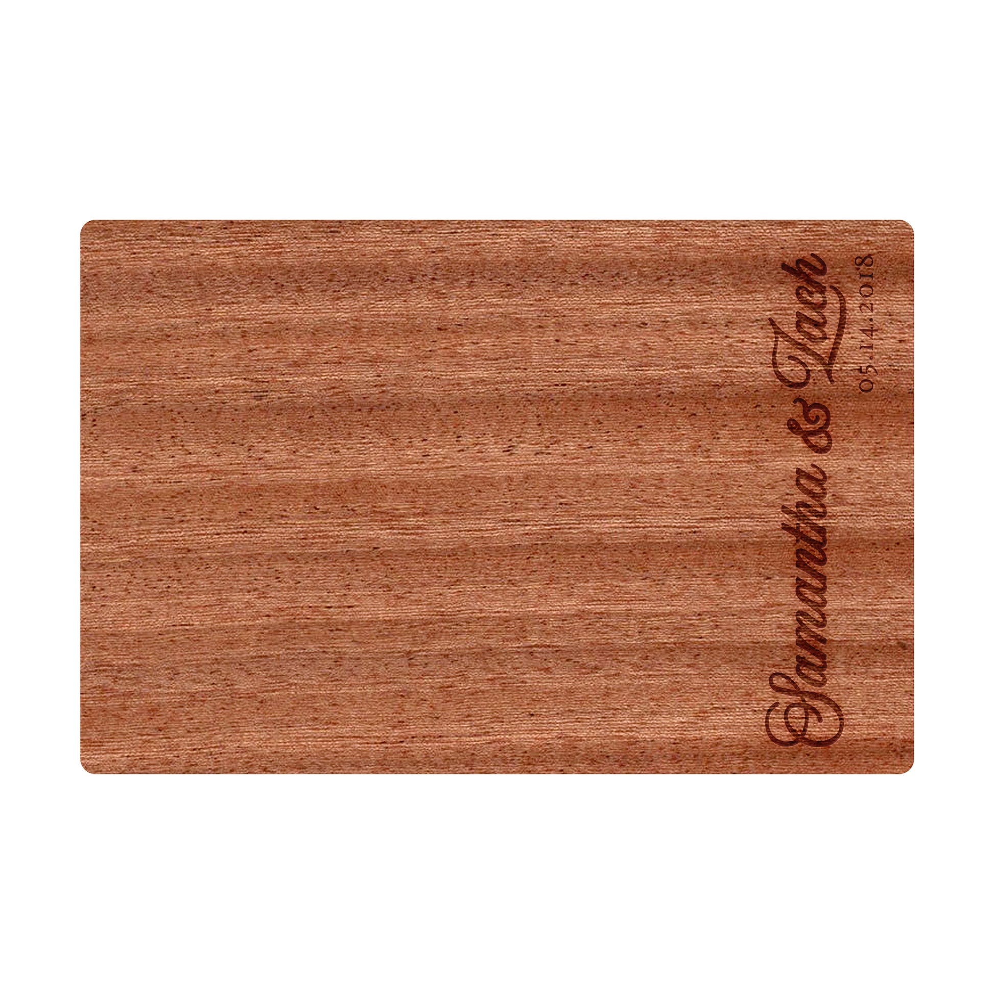 a wooden cutting board with a name on it